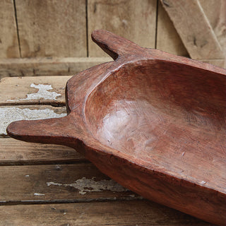 Empty rustic dough bowl on wooden table