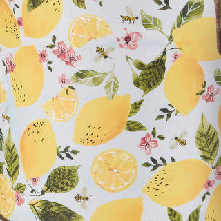 Close-up of yellow lemon botanical print with bees and pink blossoms on white metal bucket

