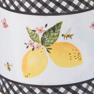 Detail of hand-painted lemons and gingham border on farmhouse storage container

