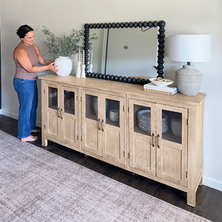 Light wood sideboard buffet styled in modern dining room
