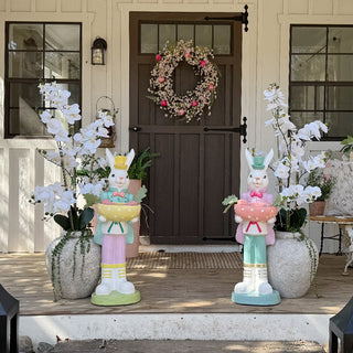Easter porch decor with bunny statues and spring florals