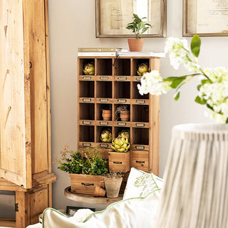 Vintage wood apothecary cabinet with 16 numbered cubbies and metal label holders in natural fir wood finish