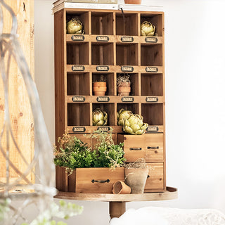 Bottom drawers with metal handles on farmhouse style library card catalog cabinet