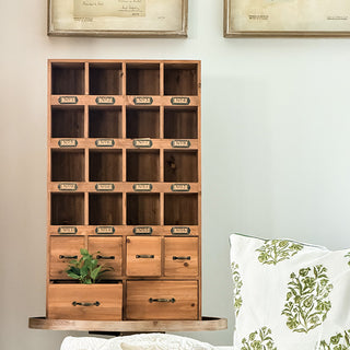 Full front view of assembled vintage apothecary storage cabinet with 22 total storage compartments