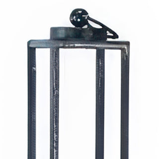 Top view of decorative loop handle and open frame construction on tall black metal lantern