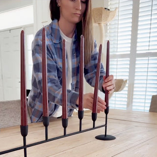 woman holding candle holder