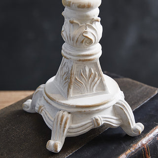 Ornate distressed white candlestick base detail