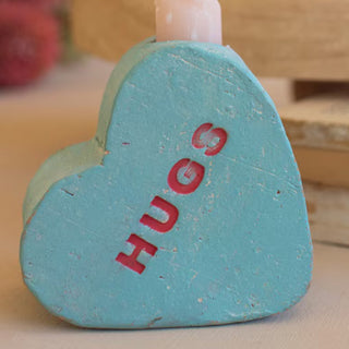 Blue HUGS clay conversation heart candle holder detail shot showing pastel color distressed texture Valentine's Day décor