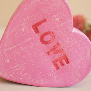 Pink LOVE clay conversation heart vase close up showing distressed finish hand-painted lettering Valentine home accent