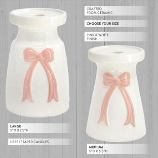 white ceramic candleholder with sculpted pink bow taper candle riser