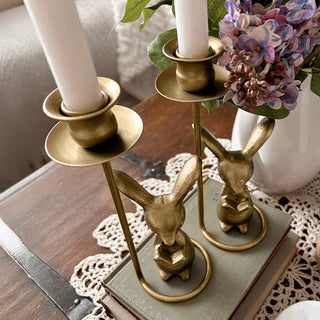 Close-up brass bunny figurine candle holder detail