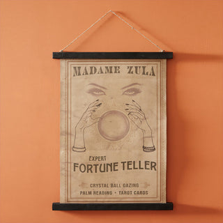 Madame Zula fortune teller vintage wall canvas with crystal ball design, hanging on orange wall with wooden frame