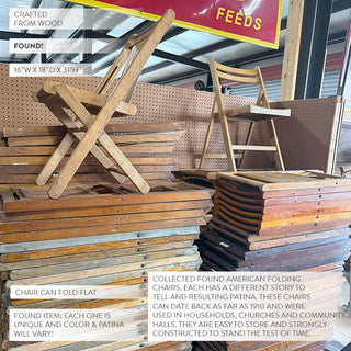 Collection of antique American wooden folding chairs stacked on display in a warehouse with various wood tones and patinas