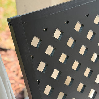 Black wooden outdoor rocking chair with white cushion