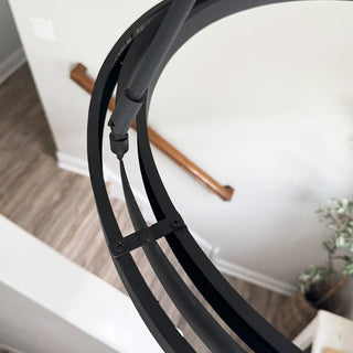 Black metal ring chandelier detail close-up