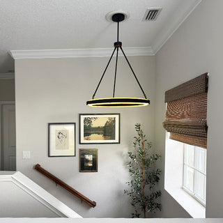 Contemporary stairwell with black LED pendant light