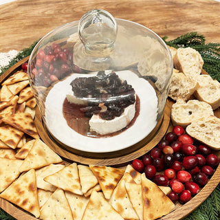 Glass cloche on wood tray for cheese display