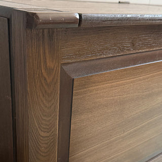 Open storage compartment inside wooden bench