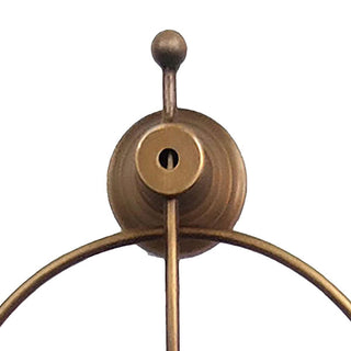  Detail shot of decorative ball finial and mounting hardware on bronze gold oval frame clock