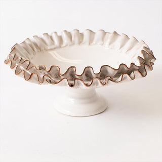Ivory ceramic ruffled bowl styled coffee table decor

