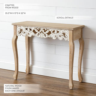 Close-up view of natural wood console table showing detailed scroll carving on apron and cabriole legs with product dimensions 35.5 inches wide by 15 inches deep by 32 inches high