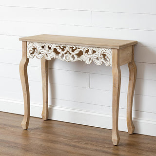 French Provincial natural wood entryway console table with carved scroll apron and cabriole legs shown in white shiplap interior setting