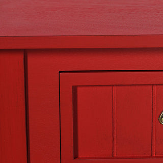 Close-up of antique red wood console table showing textured wood grain and detailed drawer panel
