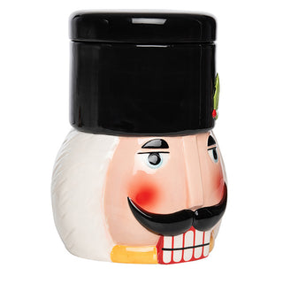Side angle view of Christmas nutcracker cookie jar showing smooth glossy finish traditional nutcracker profile and white body with painted details