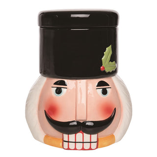 Front view of nutcracker cookie jar with removable black hat lid featuring festive holly and red berry accent Christmas holiday kitchen storage decoration