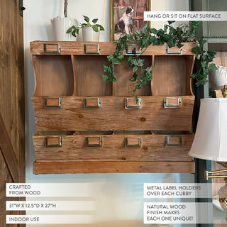 Wooden storage unit with metal label holders, decorative plants, and a dog picture on a white wall. Samplers counter