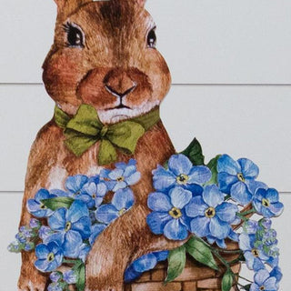 Close-up detail of hand-painted bunny face with pink ears green bow tie and blue hydrangea basket showing watercolor art style