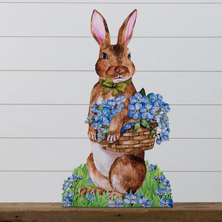 Add instant spring charm with this 28" hand-painted wooden bunny yard stake holding a basket of blue hydrangeas.