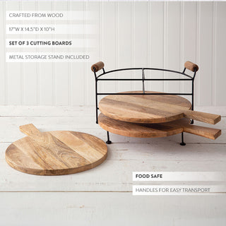 Three wooden cutting boards with metal storage stand