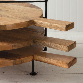 Close-up wooden cutting board handles on stand