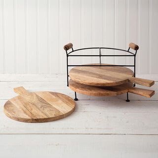 Wood cutting boards displayed with metal storage stand