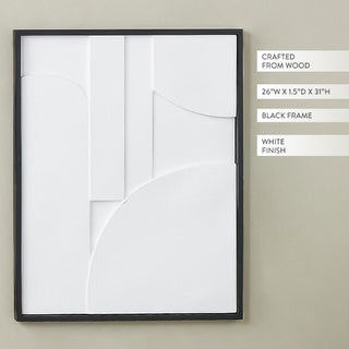 Close-up of white dimensional geometric wall art showing raised sculptural details and black frame