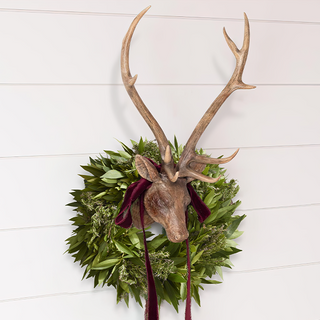  Rustic antique brown distressed resin deer head wall mount with realistic antlers and fresh greenery wreath for holiday Christmas farmhouse decor
