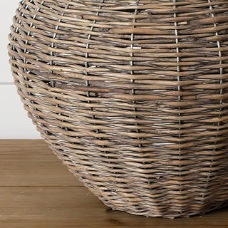 Natural wicker demijohn woven texture detail showing rustic wood basket weave craftsmanship and organic finish