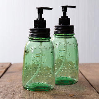 Set of two green glass soap dispensers farmhouse style