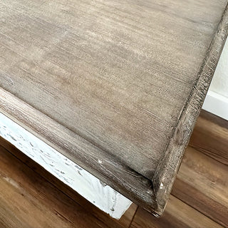Top-down view of embossed ceiling tile pattern on side table surface