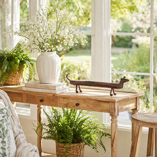 Rustic wooden console table with metal dachshund decor