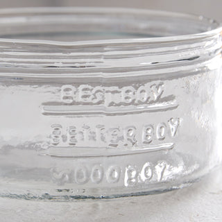 Close-up embossed glass dog bowl text detail