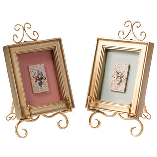  Set of two gold ornate tabletop picture frames
