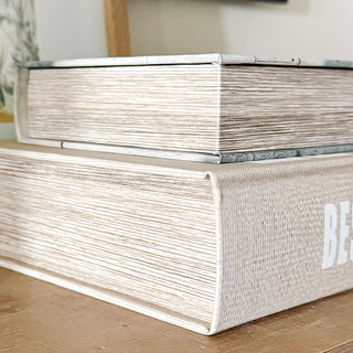 Detailed close-up of the textured faux book storage boxes showing realistic page edges and craftsmanship