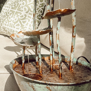 Cascading metal lotus fountain water flow detail