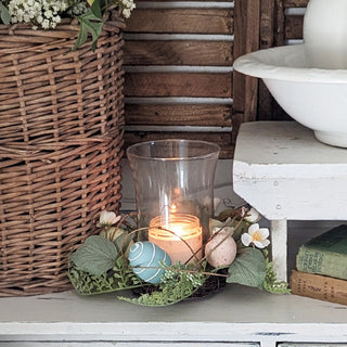 Rustic spring candle decor on farmhouse shelf