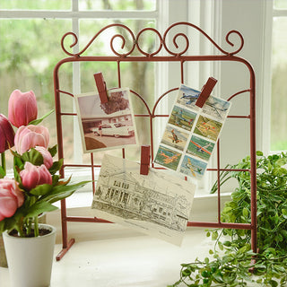  Farmhouse-style red metal card display stand with decorative scrollwork and clips for photos, recipe cards, and notes