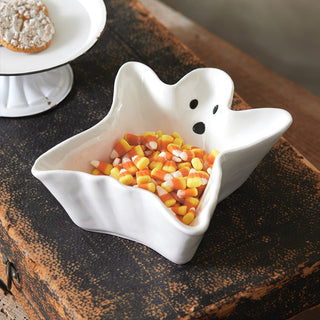 White porcelain ghost candy dish filled with candy corn, Halloween tabletop decor