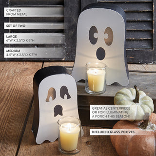 Set of two ghost-shaped metal candle holders with glass votives