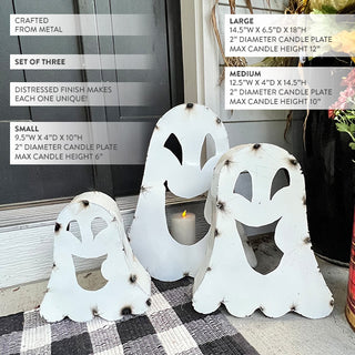 Set of three white metal ghost candle holders